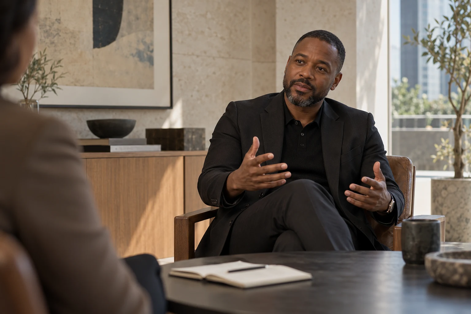 Illustrative executive reflecting during a one-to-one conversation